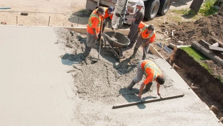 Professional concrete crew working on residential project